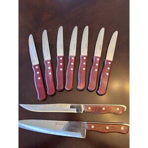 Tramontina steak and carving knives with wooden handles.